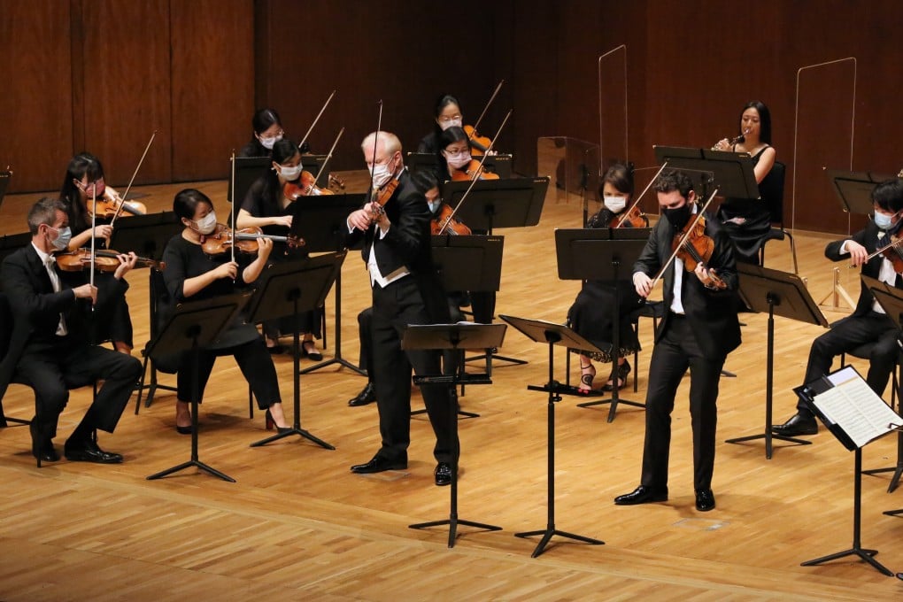 Violinist Christoph Poppen (left, front) and violist Adrien La Marca (right, front) perform Mozart’s Sinfonia Concertante with the Hong Kong Sinfonietta on March 27. Photo: courtesy Chet Lam