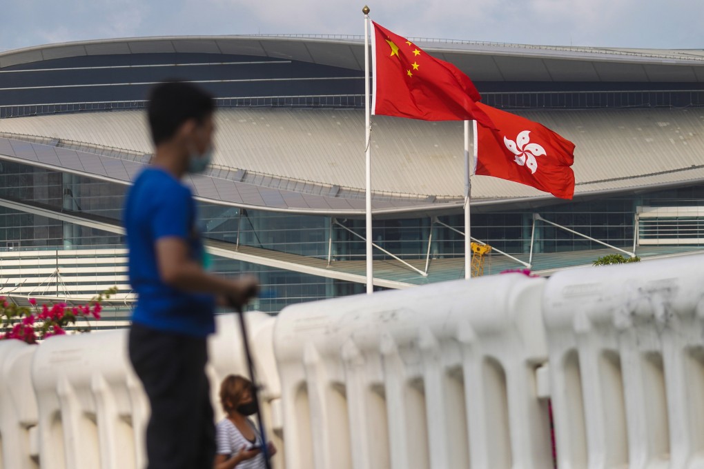 The Chinese flag and the Hong Kong flag fly outside the Legislative Council. Photo: Winson Wong