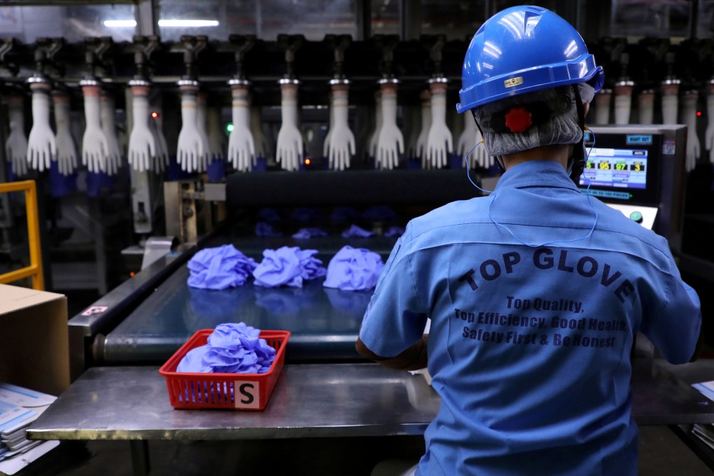 An employee works at a production line in Top Glove factory in Shah Alam, Malaysia. File photo: Reuters