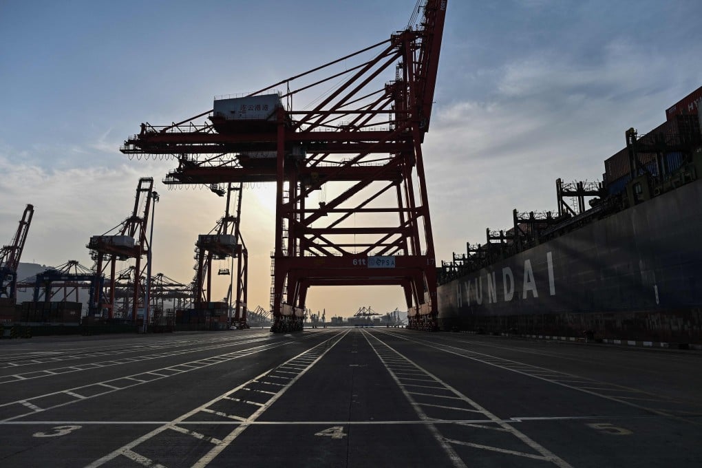 General view shows a cargo ship and cranes at the Lianyungang port container terminal in Lianyungang, Jiangsu province, China on March 24. Photo: AFP