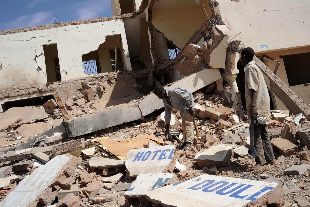 Children search in the ruins of a hotel destroyed by French air strikes in Douentza in February 2013. A new UN report says a French air strike killed 19 civilians in Mali in January. Photo: AFP