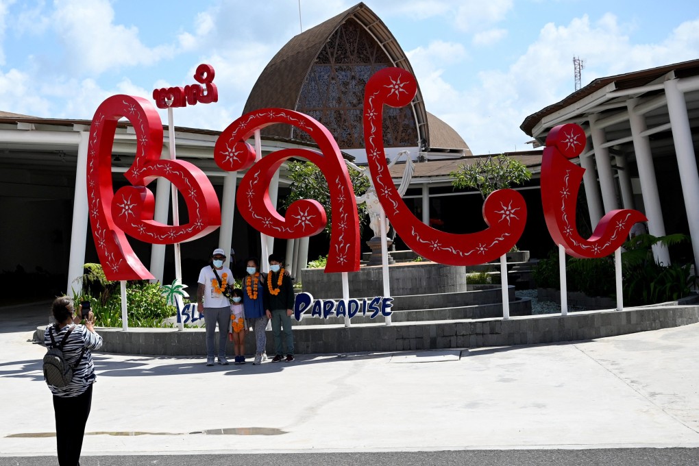 Domestic tourists arrive at Bali airport last July. Photo: AFP