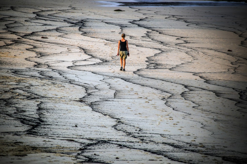 Ash from wildfires forms patterns at Narrawallee Beach in New South Wales, Australia, in January 2020. Photo: Bloomberg