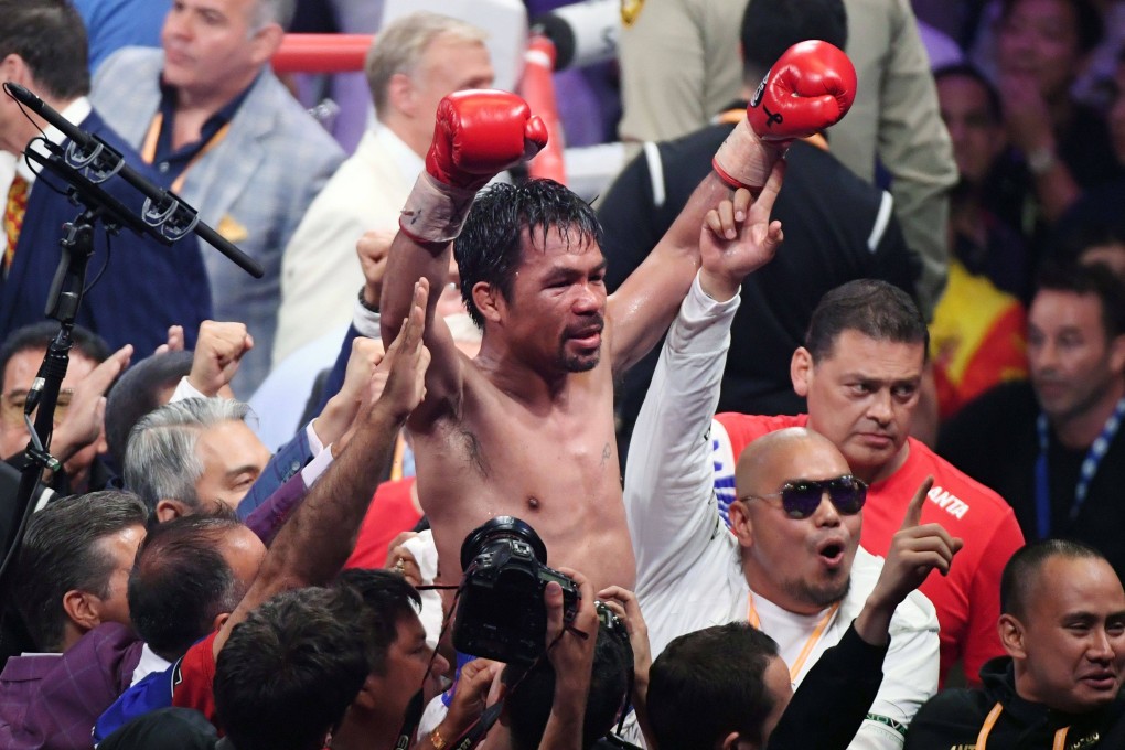 Manny Pacquiao celebrates his split-decision victory over Keith Thurman in their WBA welterweight title fight. Photo: AFP