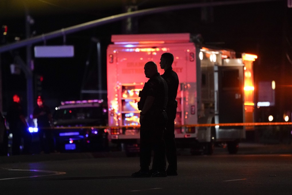 Police officers stand outside the office building where a shooting occurred in Orange, California. Photo: AP