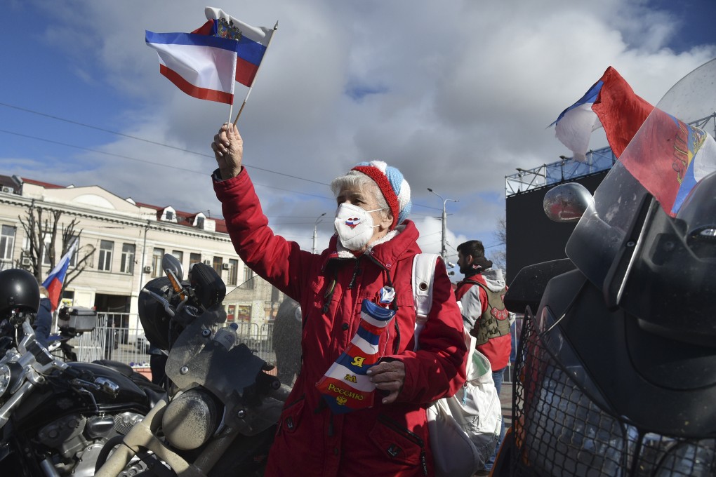 A woman attends the celebration of the seventh anniversary of Russia’s annexation of Crimea in Sevastopol. File photo: AP