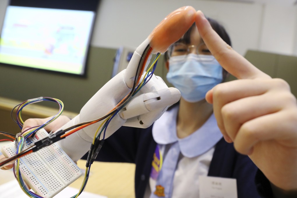 Tan Yingran, a student of Lai King Catholic Secondary School, showcases the “super skin” project that won her team the championship in the junior division of Hong Kong Student Science Project Competition 2020 last November. The Hong Kong government has been investing in boosting students’ innovative capabilities and digital competency. 
Photo: Dickson Lee