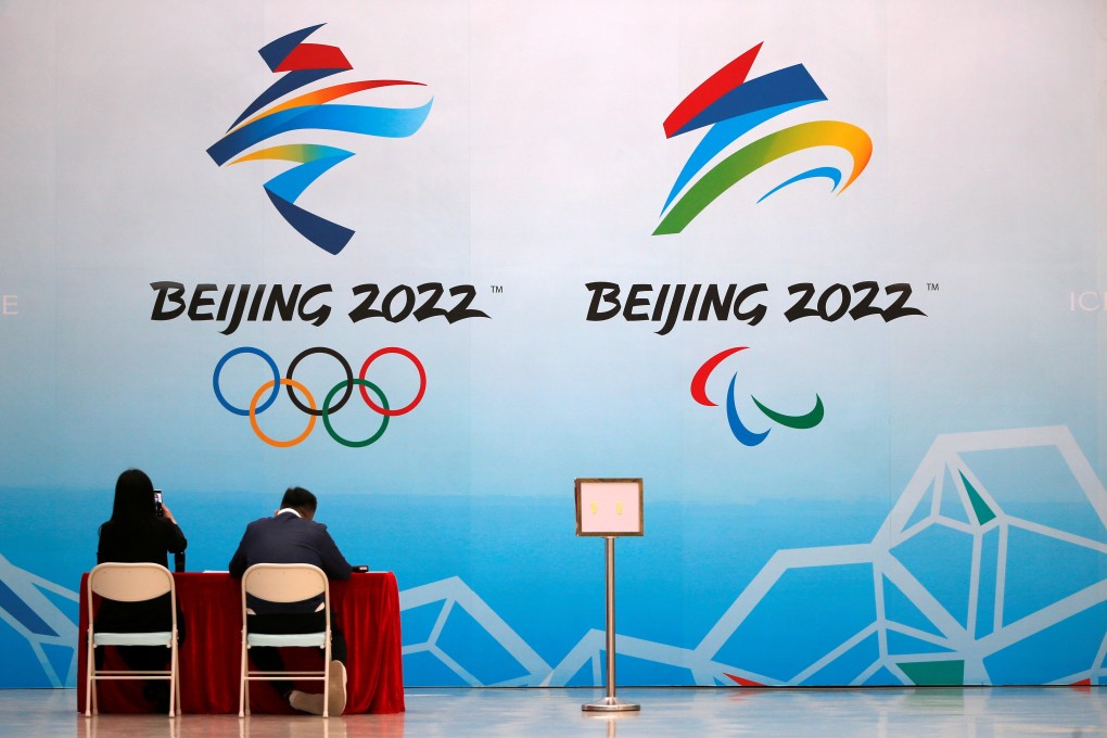 Staff members of the 2022 Olympic Winter Games at the National Aquatics Center, now known as the Ice Cube, in Beijing on Thursday. A new survey suggests that more than half of Canadians favor boycotting the games. Photo: Reuters