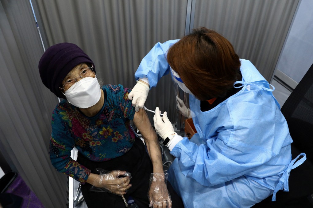 A South Korean woman receives her first dose of the Pfizer-BioNTech coronavirus vaccine in Seoul. Photo: Reuters