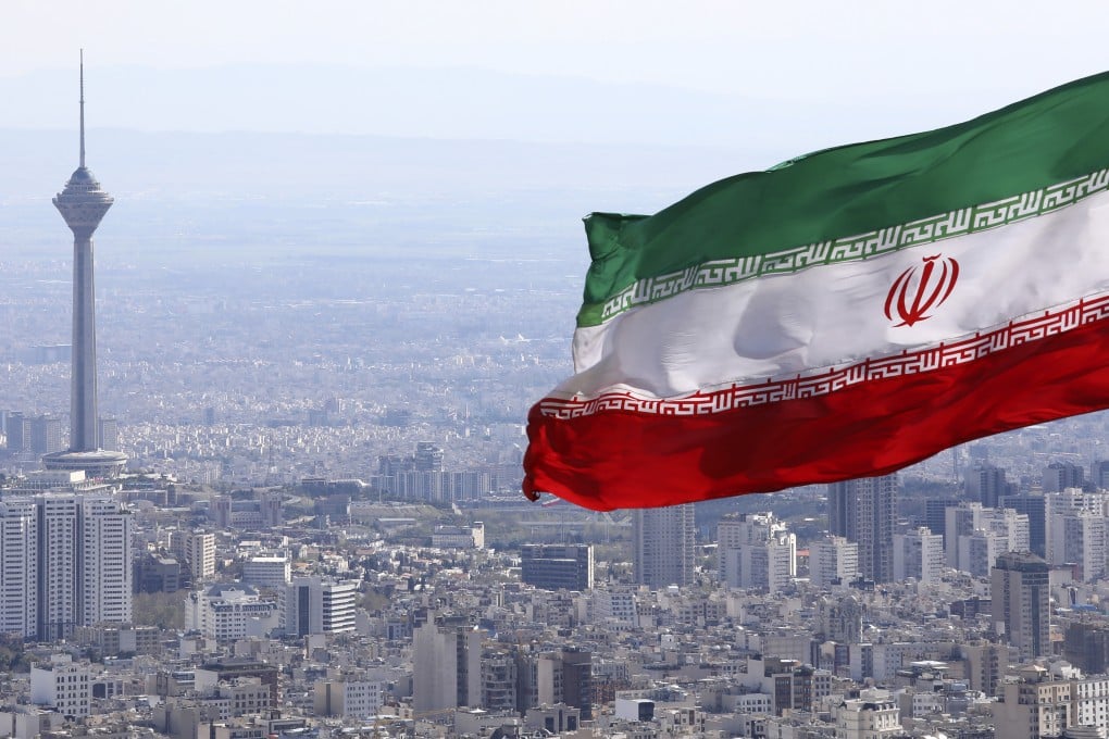 Iran’s flag is seen waving over Tehran in March 2020. Photo: AP