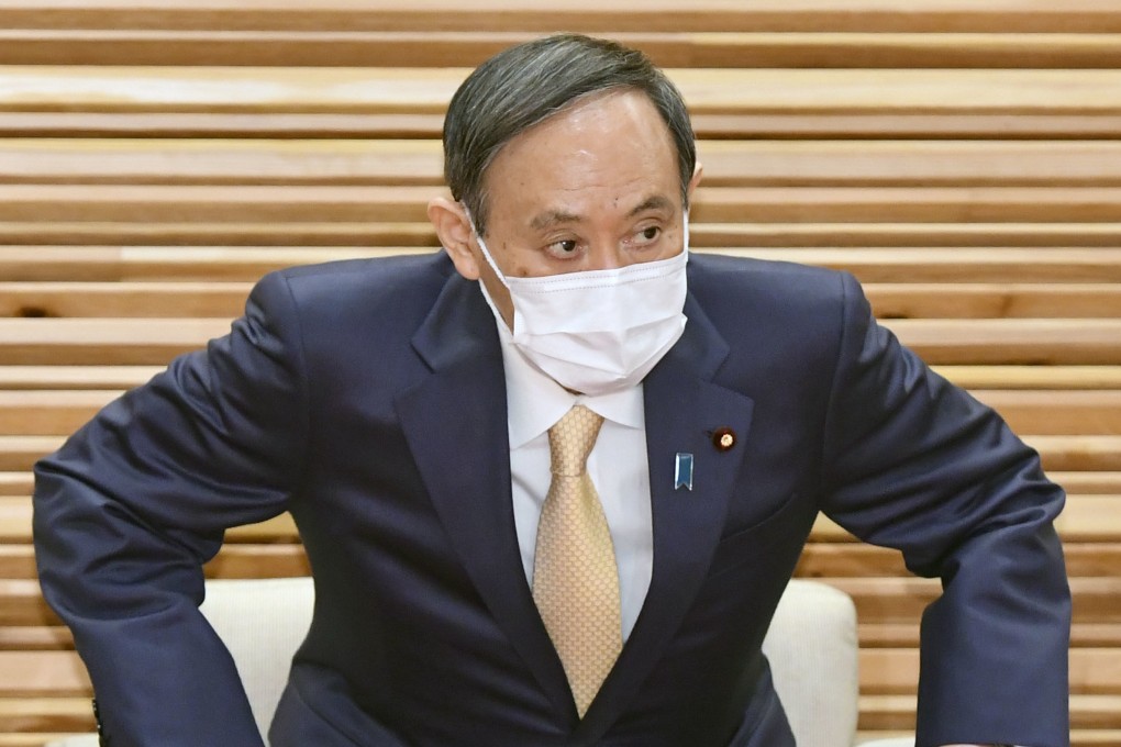 Japan’s Prime Minister Yoshihide Suga attends a cabinet meeting at his office in Tokyo on Friday. Photo: Kyodo