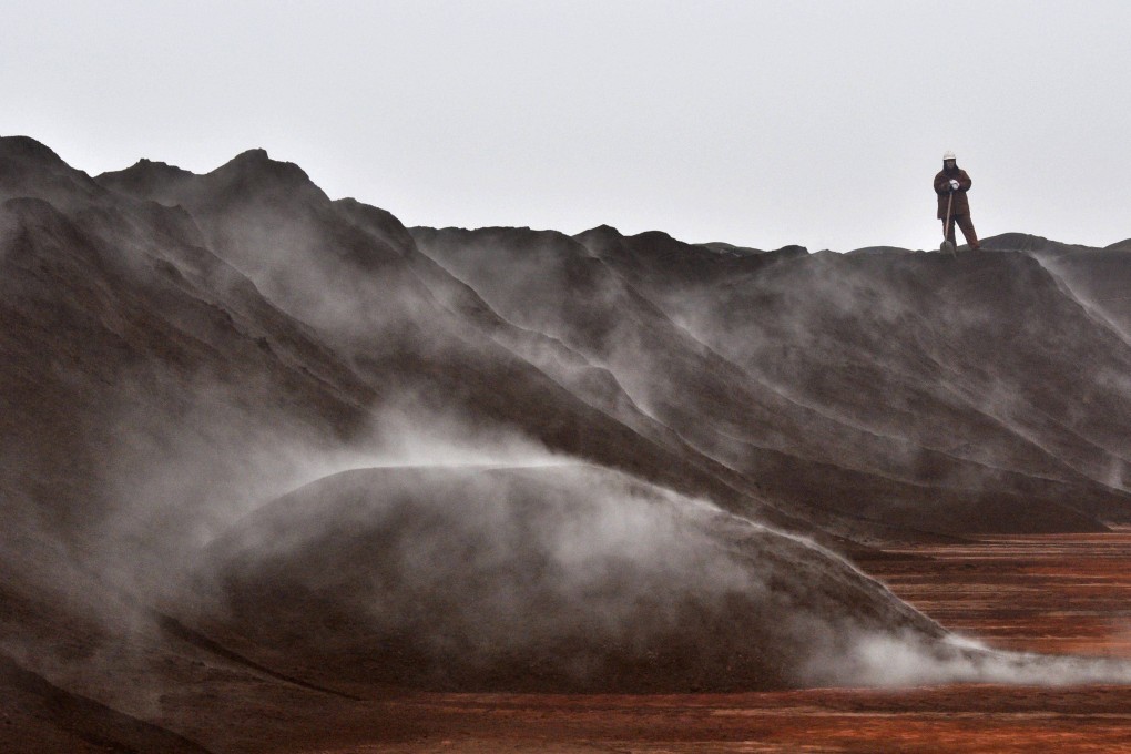 Iron ore from Australia is unloaded at the port in Tianjin, China. Photo: Reuters