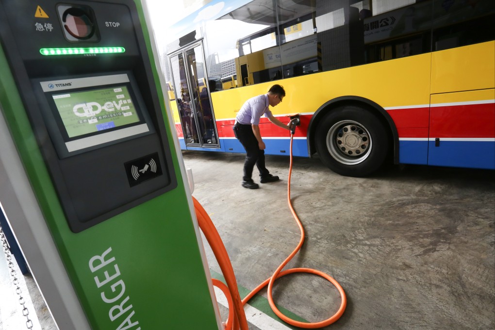 A driver charges an electric bus after Citybus and First Bus jointly launched the second batch of electric single deckers in Chai Wan on September 7, 2016.Hong Kong has not adopted an aggressive strategy for greening public transport and commercial vehicles. Photo: Jonathan Wong