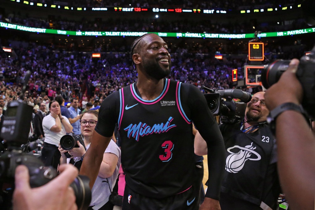 Dwyane Wade celebrates a three-point shot in a 2019 NBA match against the Golden State Warriors. Photo: TNS