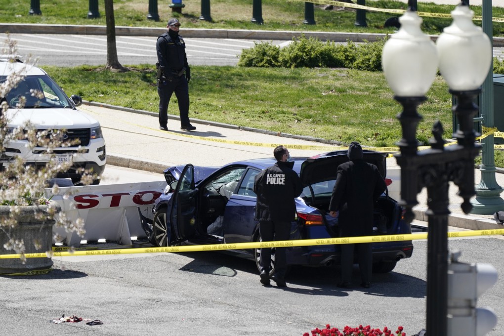 US Capitol Police officers stand near a car that crashed into a barrier on Capitol Hill in Washington on Friday. Photo: AP