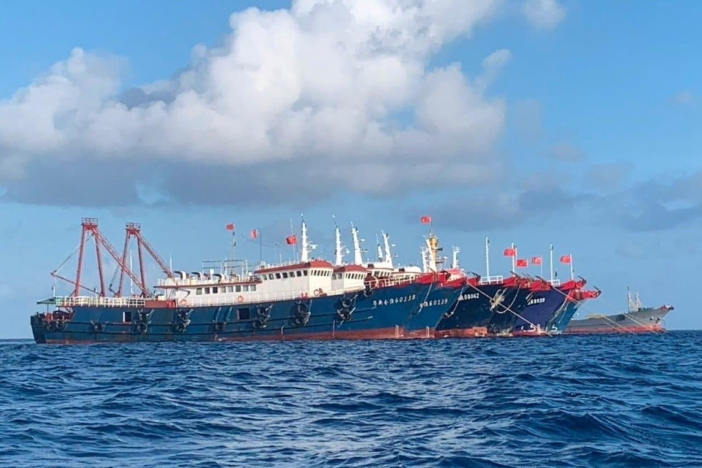 Chinese vessels, believed to be manned by Chinese maritime militia personnel, are seen at Whitsun Reef, South China Sea on March 27, 2021. Photo: Handout via Reuters