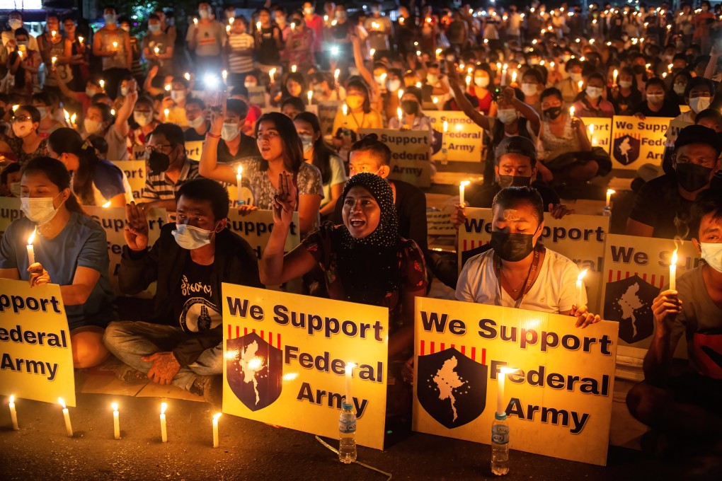 Protesters hold a candlelit vigil in Yangon on Friday. Photo: Photo: ZUMA Wire/DPA