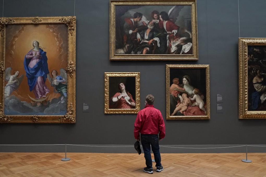 A patron looks at paintings on display at the Metropolitan Museum of Art in New York. Photo: AFP