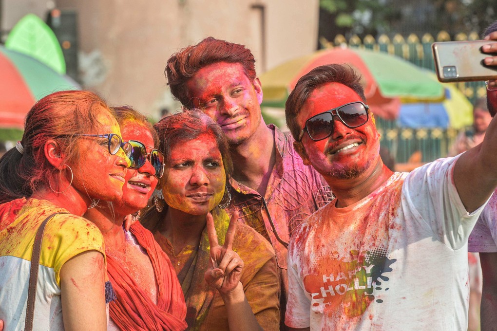 Revellers take selfies as they celebrate Holi, the spring festival of colours, in Siliguri. Photo: AFP