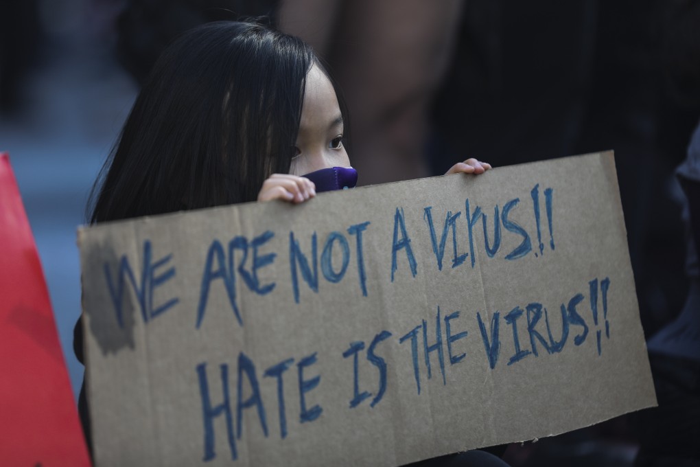 A girl takes part in a protest in New York against hate crimes targeting Asians on March 21. Photo: Xinhua