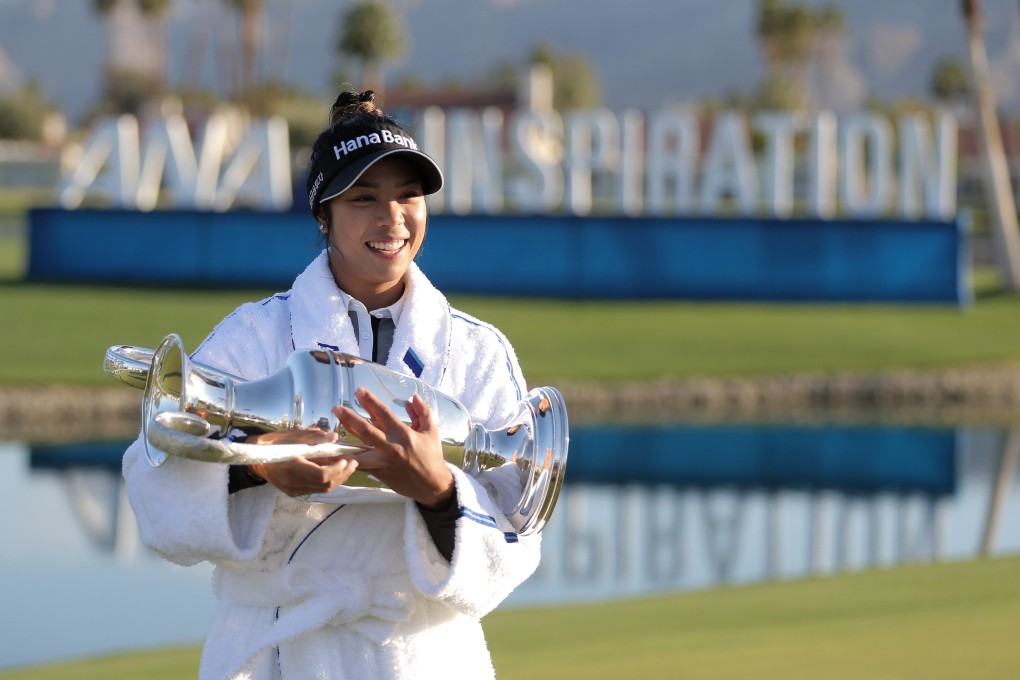 Patty Tavatanakit of Thailand poses with the trophy after winning the 2021 ANA Inspiration at the Dinah Shore course at Mission Hills Country Club. Photo: AFP
