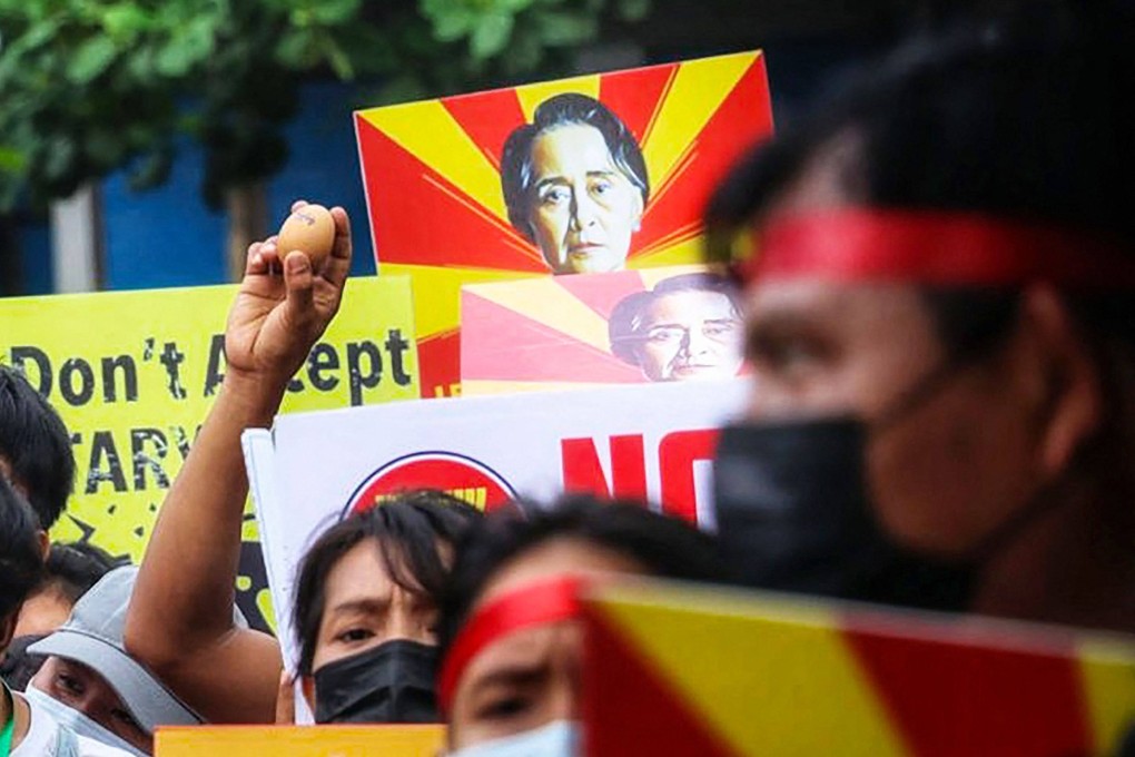 A protester holds up an egg during an Easter protest calling for the return of civilian rule in Myanmar. Photo: AFP