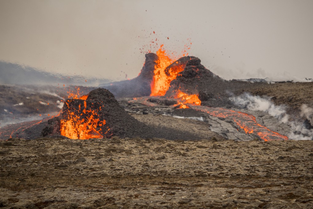Steam and lava spurt from a new fissure on a volcano on the Reykjanes Peninsula in southwestern Iceland on Monday. Photo: AP