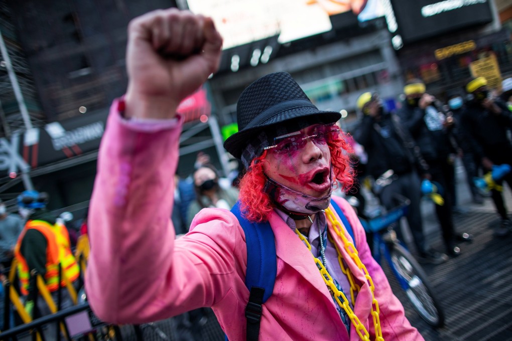 A protester takes part in a Stop Asian Hate rally at Times Square in New York on Sunday. Photo: Reuters