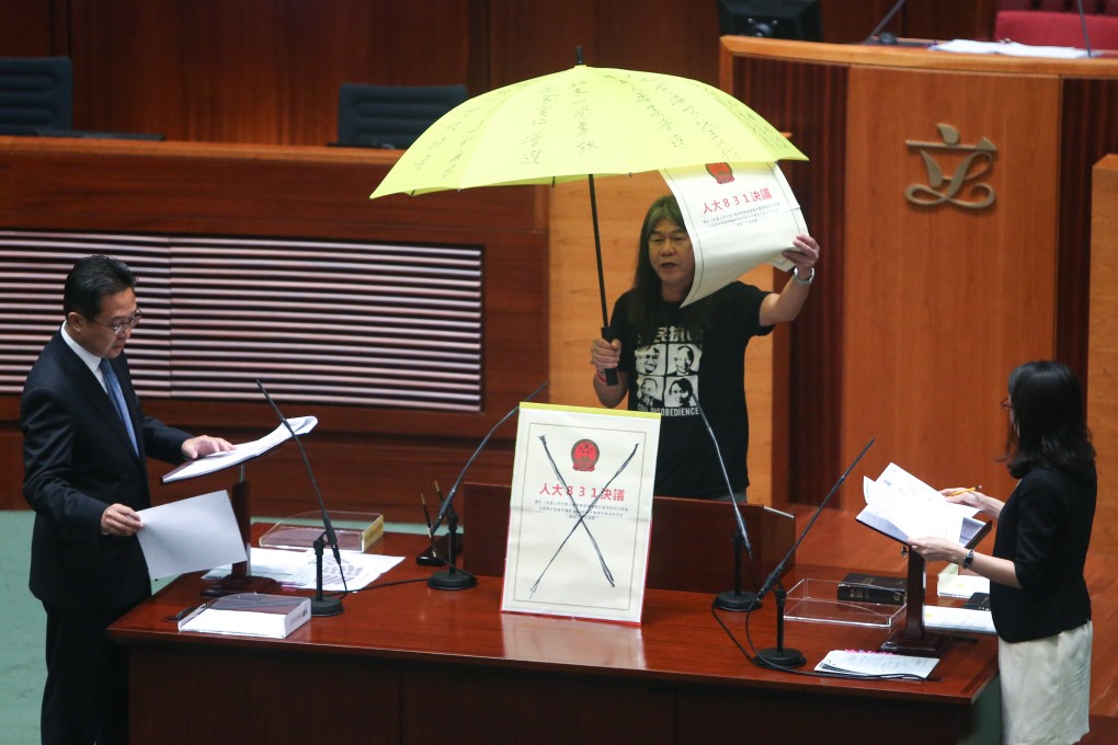 Moves such as raising an umbrella, carried out here by former legislator Leung Kwok-hung in 2016, during oath-taking is not acceptable, officials have warned. Photo: Dickson Lee