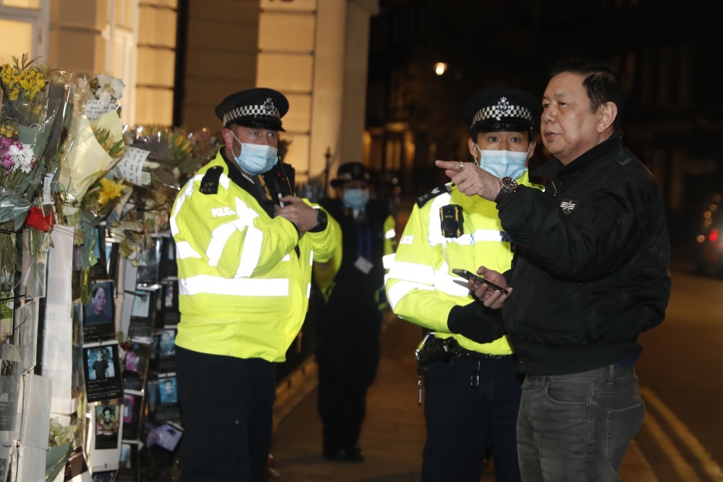Myanmar ambassador Kyaw Zwar Minn talks to police outside his country’s embassy in London on Wednesday. Photo: AP