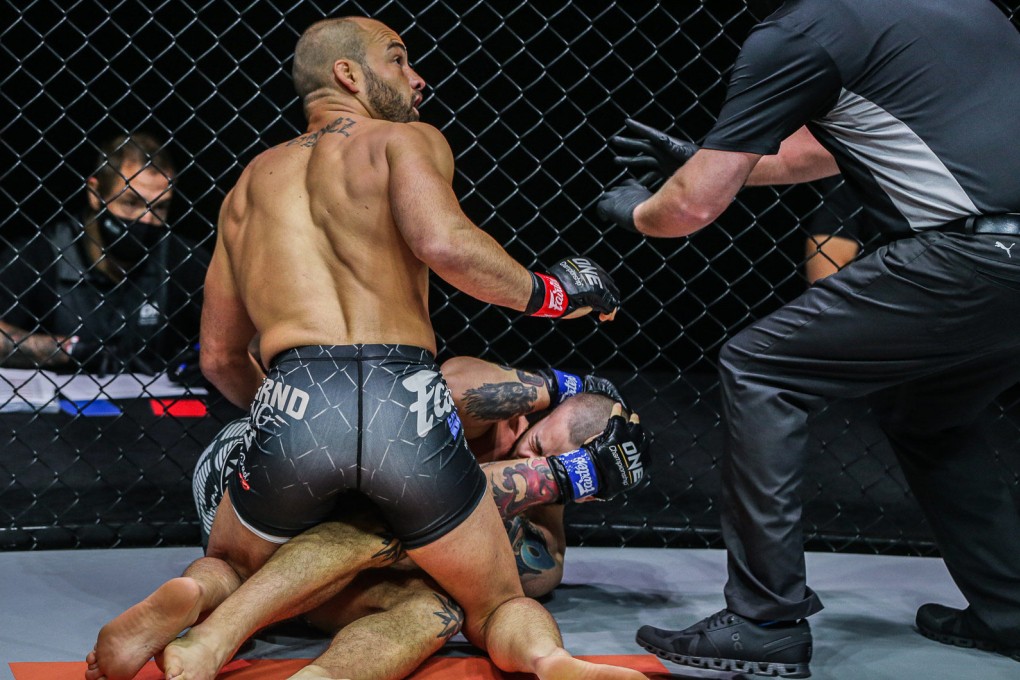 The referee calls a time out after deeming that Eddie Alvarez has landed illegal blows to the back of Iuri Lapicus’ head. Photos: ONE Championship