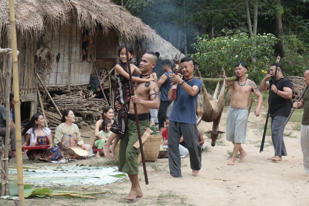 Actor Pablo Amirul (front) plays Gadang, whose longhouse is threatened by zombies in the film Belaban Hidup: Infeksi Zombie.