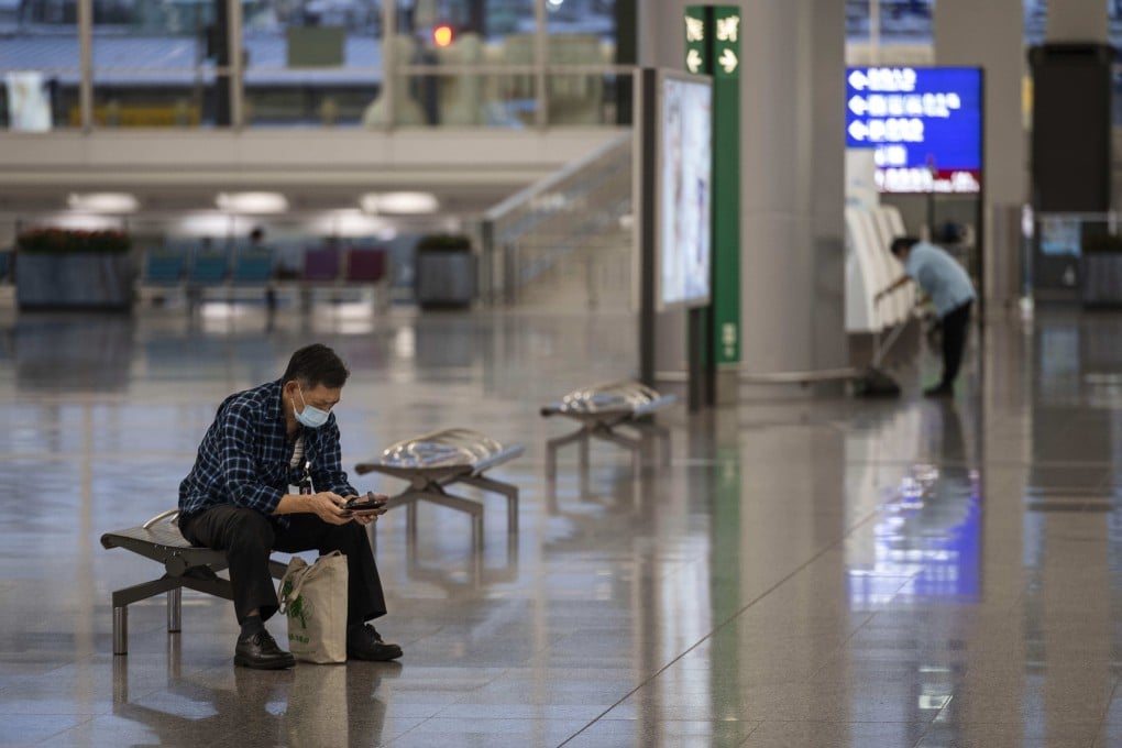 A passenger wearing a face mask waits at Hong Kong International Airport on October 24, 2020. Photo: CWH