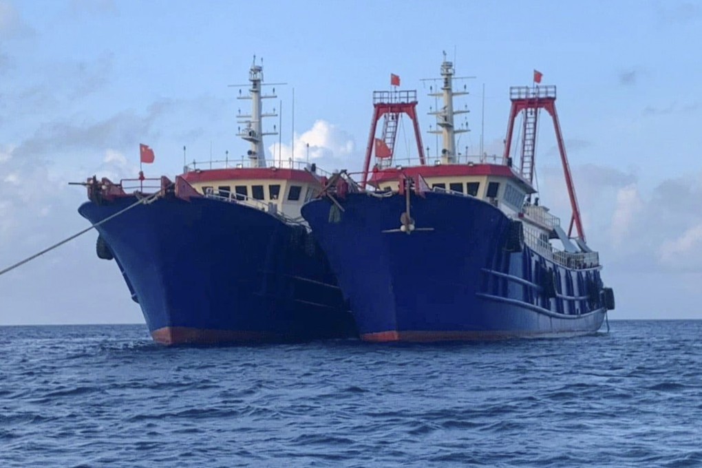Chinese vessels moored at Whitsun Reef on March 27. Photo: National Task Force-West Philippine Sea via AP