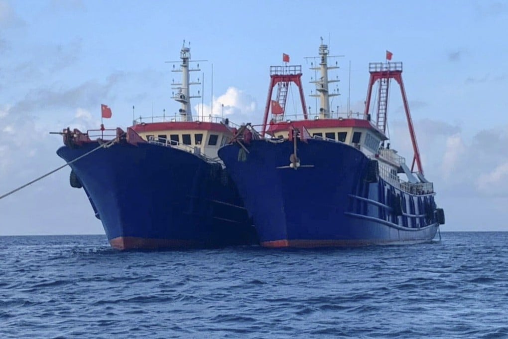 Chinese vessels moored at Whitsun Reef on March 27. Photo: National Task Force-West Philippine Sea via AP
