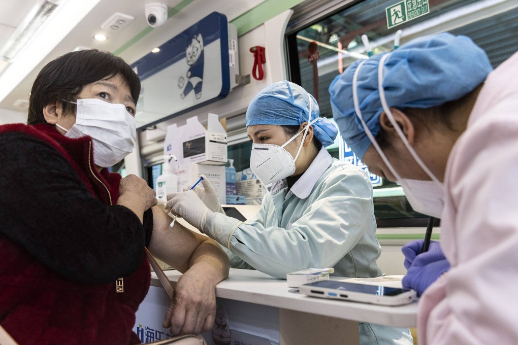 A residents gets a Covid-19 jab at a vaccination vehicle in Wuhan in March. Photo: TNS