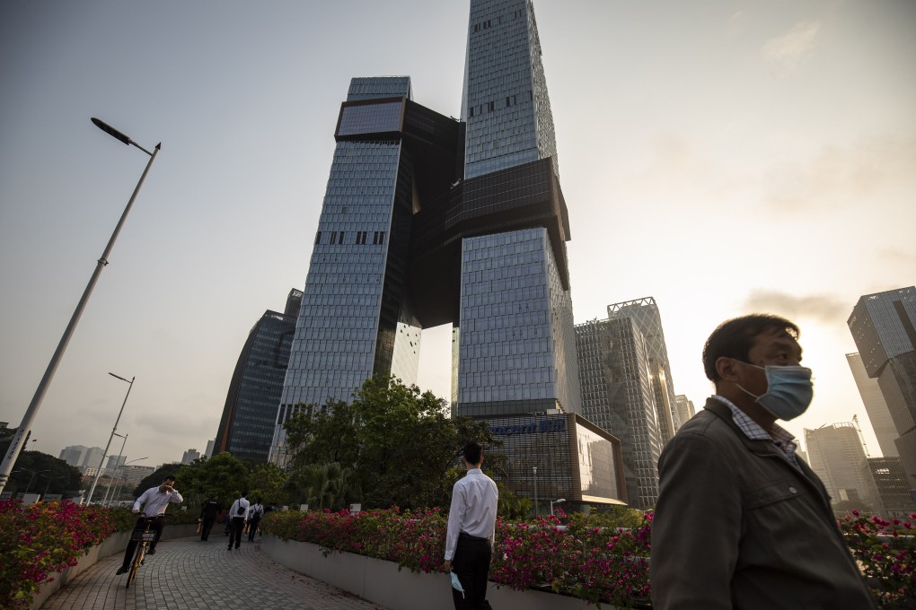 People walk along a pedestrian walkway near the Tencent Holdings headquarters in Shenzhen on March 20. Photo: Bloomberg