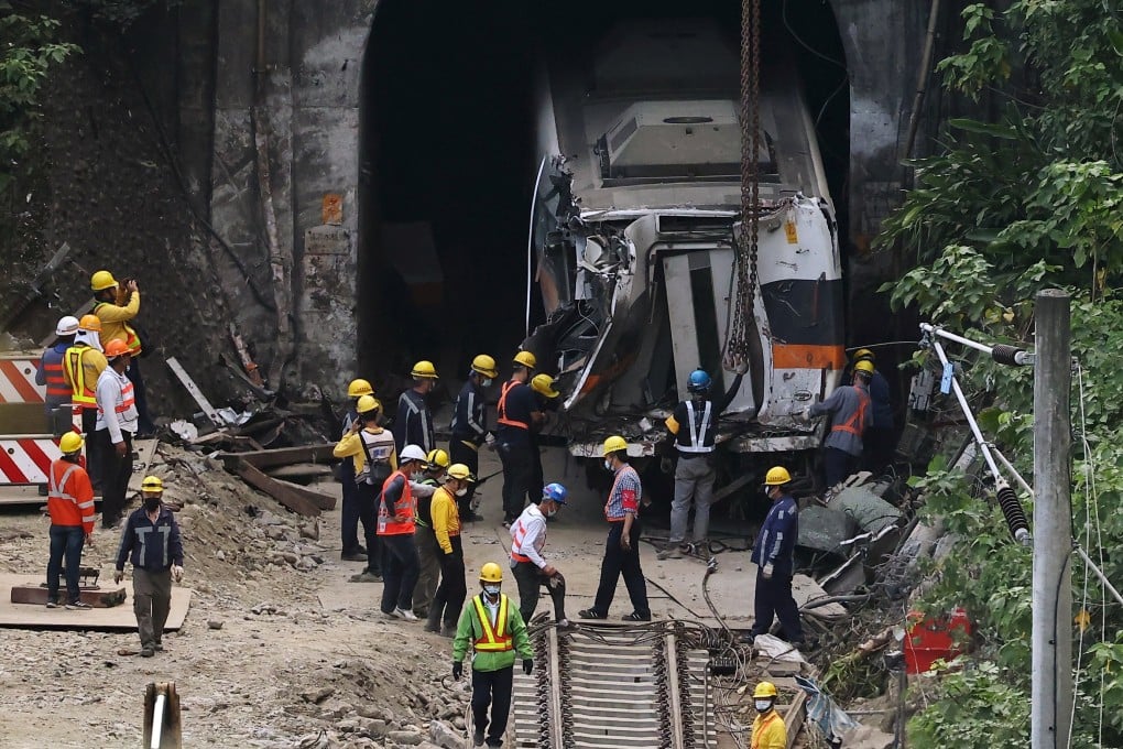 Rescue workers pull a train carriage from the tunnel in Hualien on Tuesday after the deadly crash. Photo: Reuters