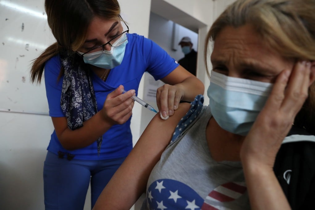 A healthcare worker administers a dose of Sinovac’s Covid-19 vaccine in Santiago, Chile. Photo: Reuters
