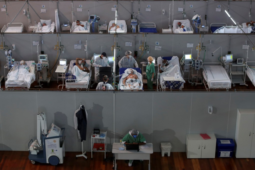 Health workers treat Covid-19 patients at a field hospital in a sports gym in Santo Andre, on the outskirts of Sao Paulo, Brazil. Photo: Reuters