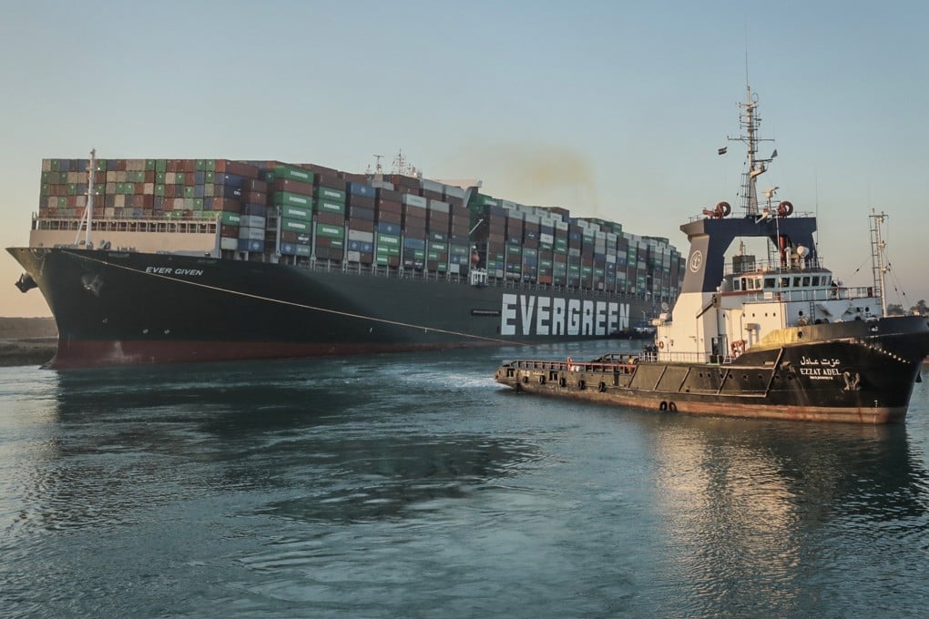 Dozens of container ships were stuck when the Ever Given ran aground in the canal on March 23, with specialist rescue teams taking almost a week to free the vessel. Photo: TNS