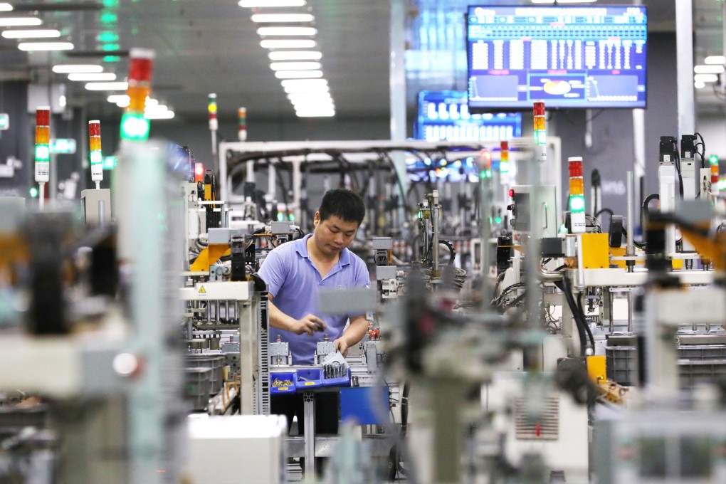 A worker is seen at the microwave oven factory of home appliances giant Midea Group in Foshan, a city in southern China’s Guangdong province, on April 1, 2021. Photo: Xinhua