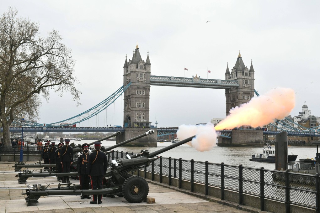 Members of the Honourable Artillery Company fire a 41-round gun salute from the wharf at the Tower of London to mark the death of Prince Philip. Photo: PA via AP