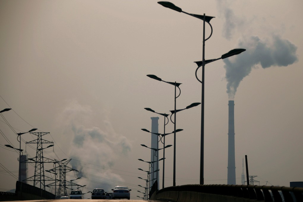 Smoke rises from chimneys of a steel plant on a hazy day in Tangshan, Hebei province. Photo: Reuters