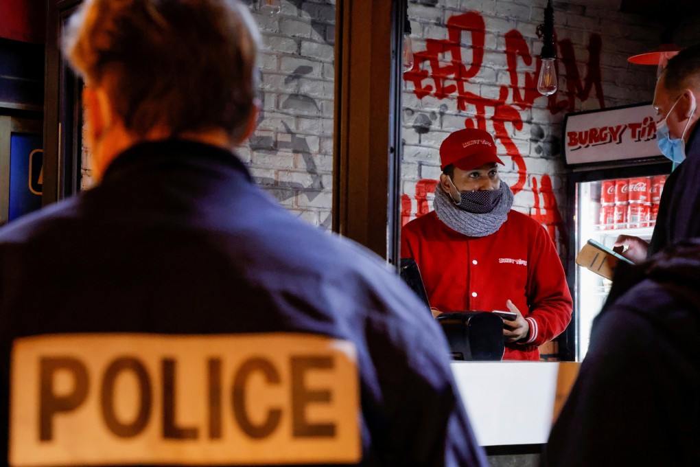 Police inspect a restaurant during a coronavirus lockdown in Paris, France. Photo: Reuters
