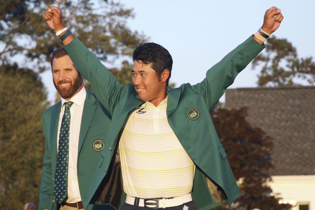 Japanese golfer Hideki Matsuyama celebrates after being presented with the green jacket after winning the Masters at Augusta. Photo: Kyodo