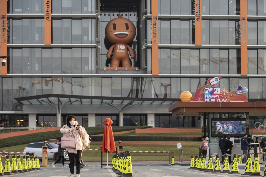 An employee exits the Alibaba Group Holding Ltd. headquarters in Hangzhou in January 2021. Photo: Bloomberg