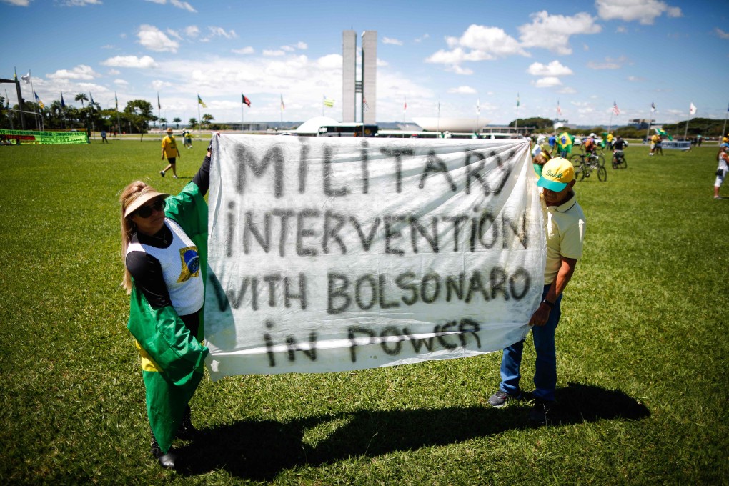 People take part in The Christian Family March for Freedom in front of the Brazilian Congress in Brasilia on Sunday. Photo: AFP