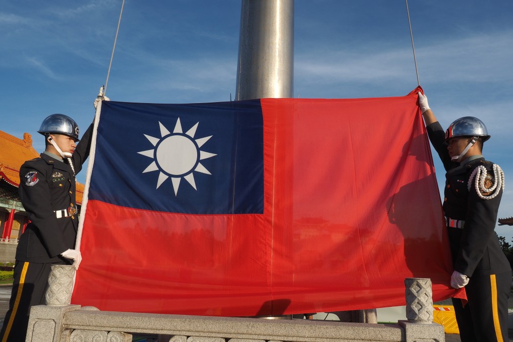 Soldiers perform a flag-raising ceremony in Taipei. Photo: EPA-EFE