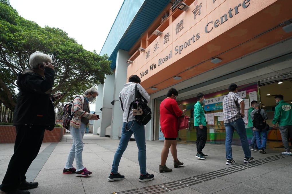 People queue up for Covid-19 vaccines at the Sha Tin community vaccination centre in Sha Tin Yuen Wo Road Sports Centre on March 27. Photo: Felix Wong